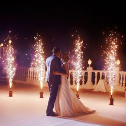 Wedding couple dancing in sparklers their first dance